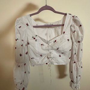 Flamenco style top w/ embroidered rose details & lace up front @ zipper back